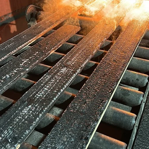 Yakisugi burning process - Multiple wooden planks being controlled burned according to traditional Japanese method